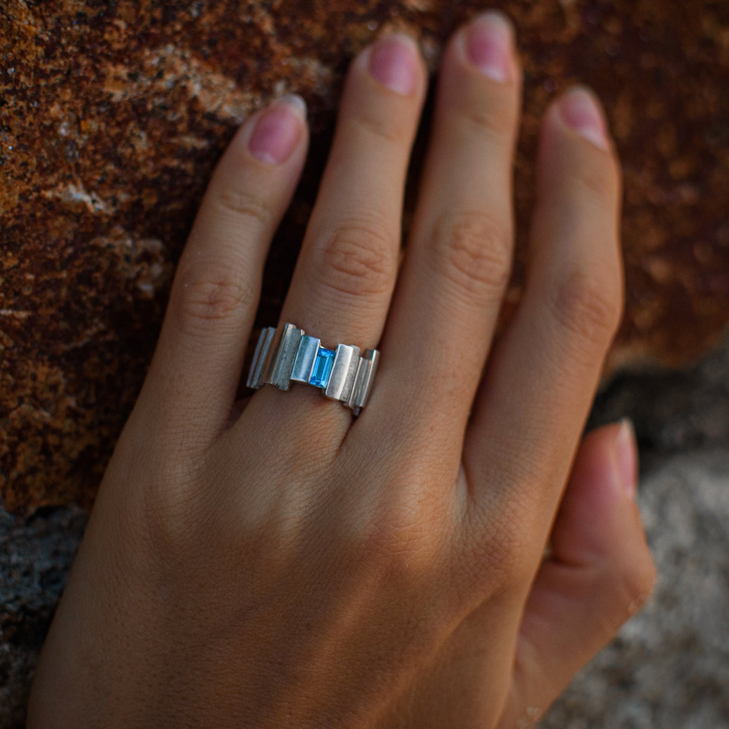 Unique wide silver ring with blue topaz stone