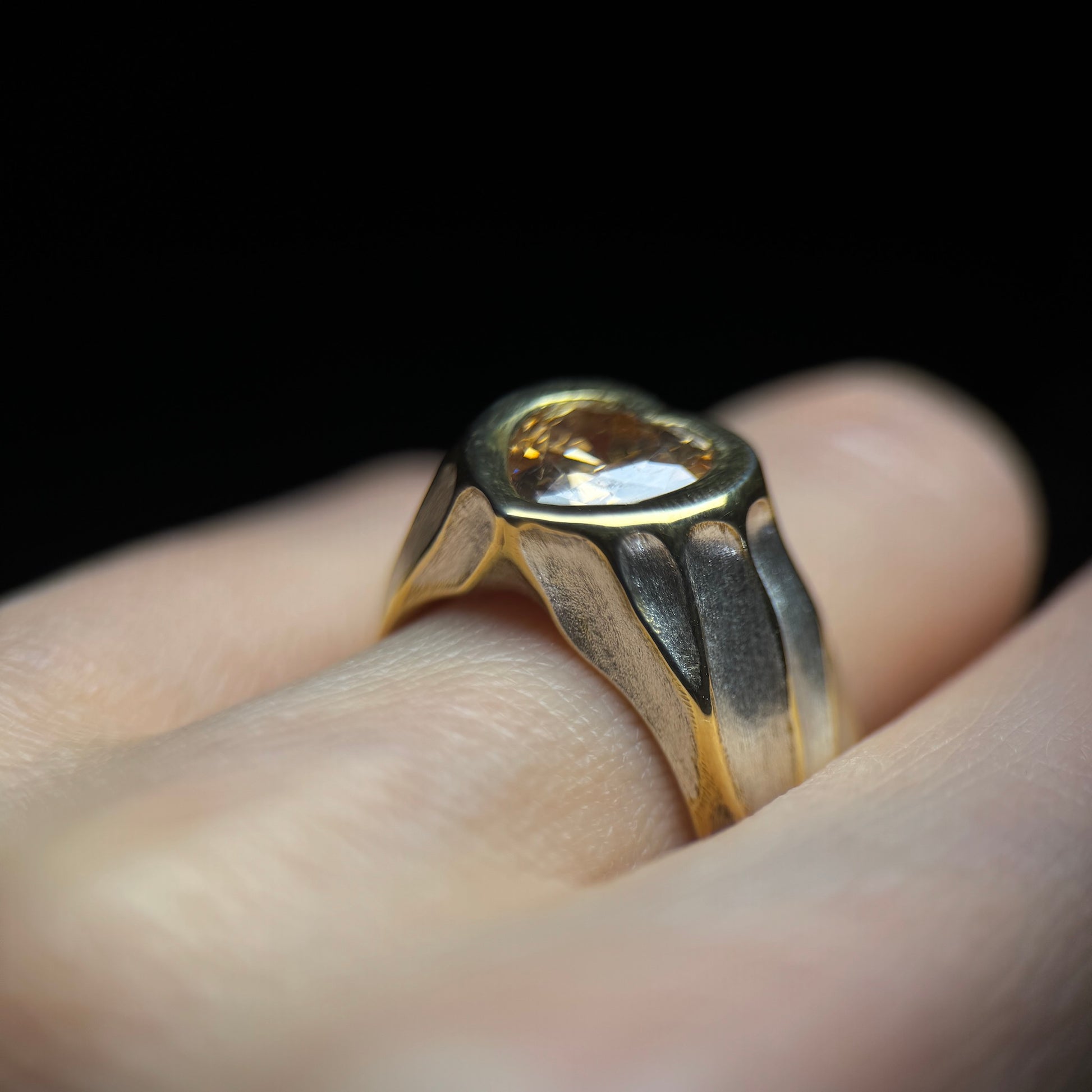 silver and gold ring heart shaped stone