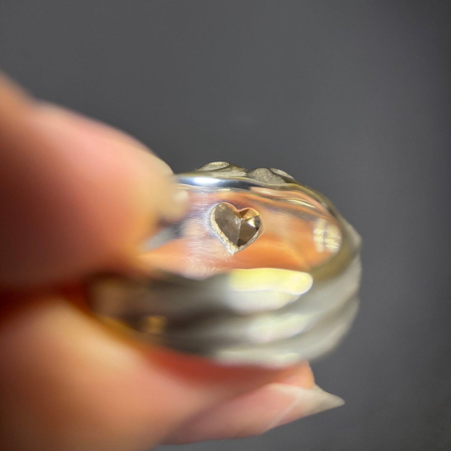 Silver ring with a secret heart design