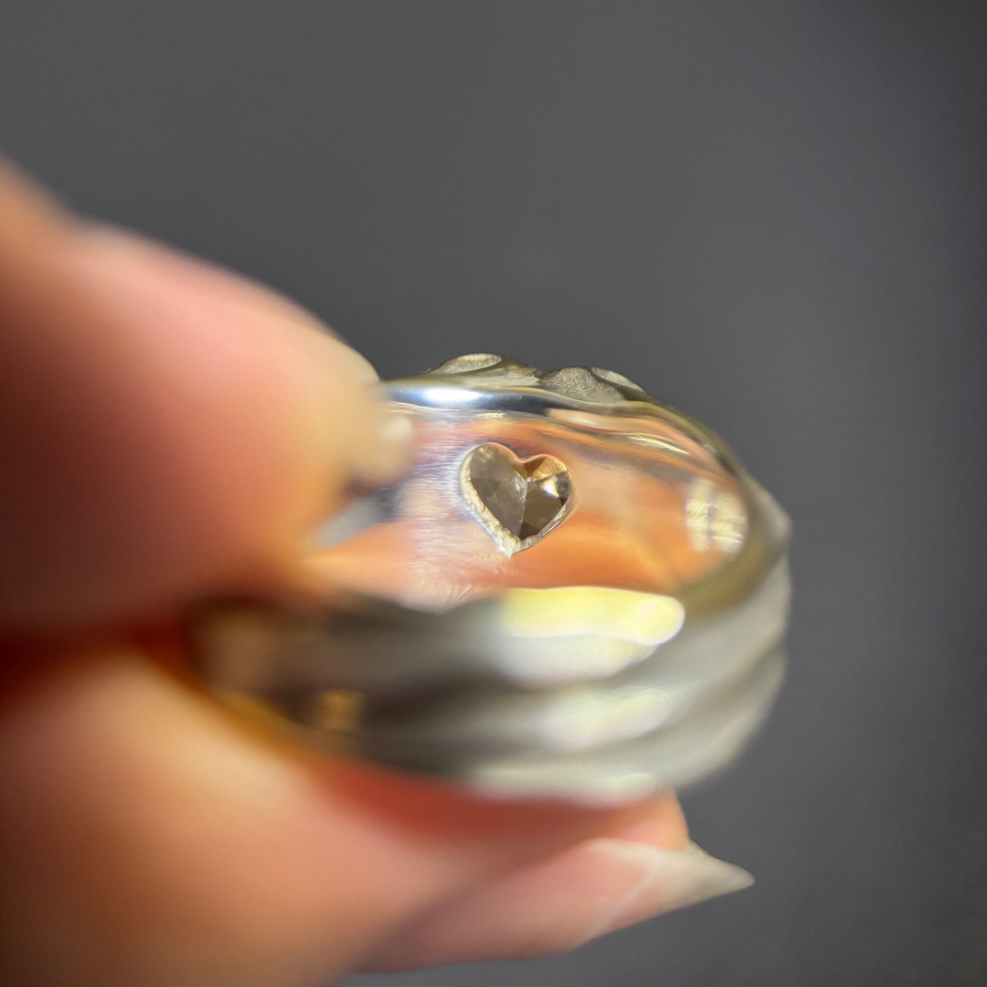 Silver ring with a secret heart design