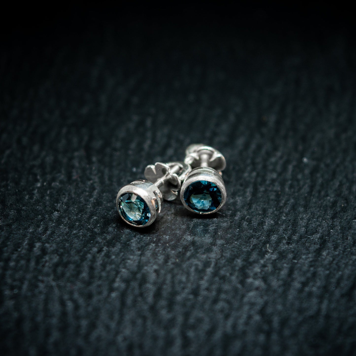 screw back studs in silver with london blue topaz