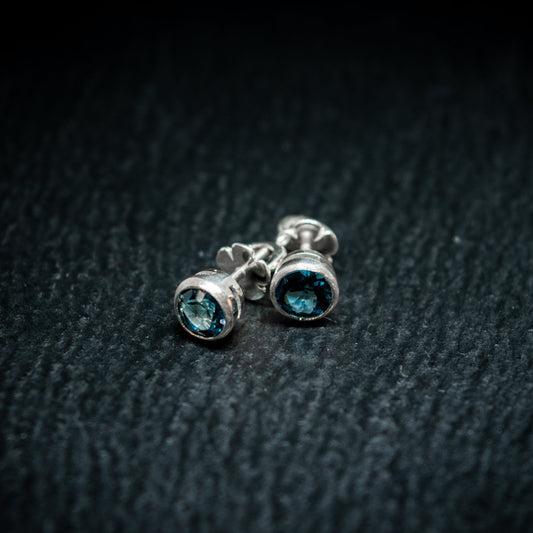 screw back studs in silver with london blue topaz