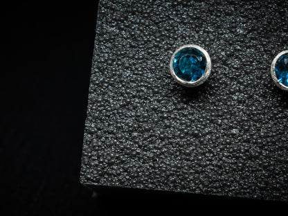 Screw back ear studs with blue topaz