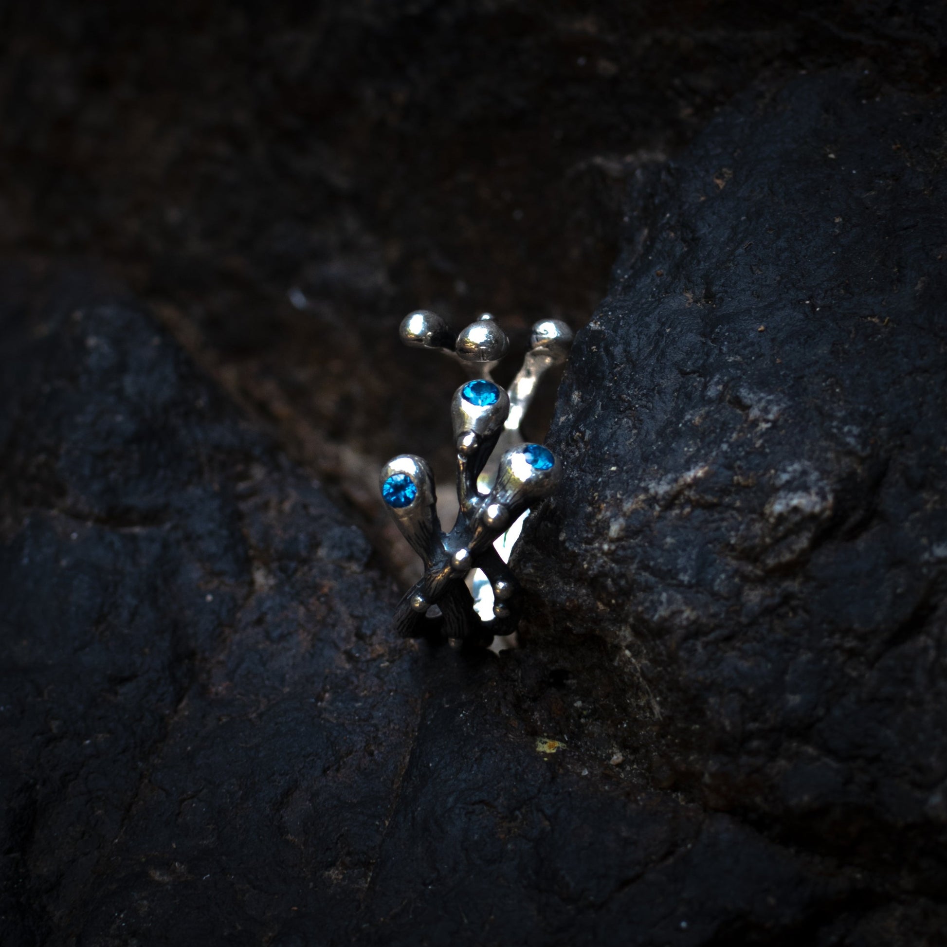 three-stone silver ring with sapphires