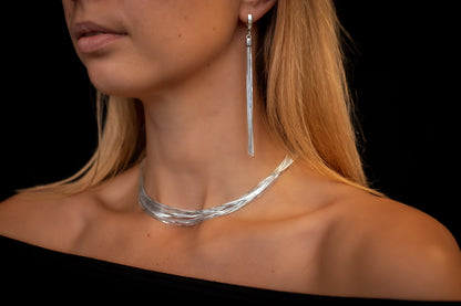 woman wearing multi strand silver jewelry set